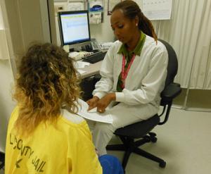 Nurse talking to an inmate