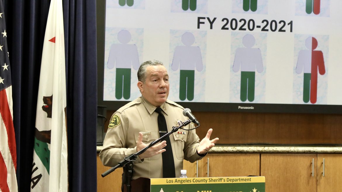 Sheriff presenting a slide infront of large screen