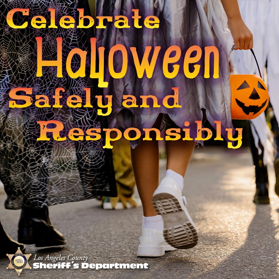 text in an orange yellow gradient that reads, "Celebrate Halloween safely and responsibly. image of three people walking down a street. the three people are pictured from the waist down, wearing a witch costume with black shoes, a ghost with white shoes.