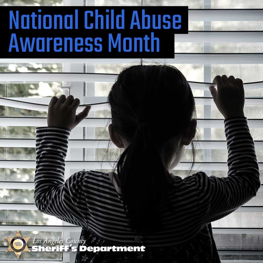 backlit picture of a child looking throgh a window with her hands on blinds, peering out.