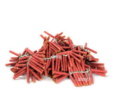 Pile of individual firecrackers that are strung together. Each individual fire cracker are red cylinders with a white fuse attaching them all together in a long ribbon
