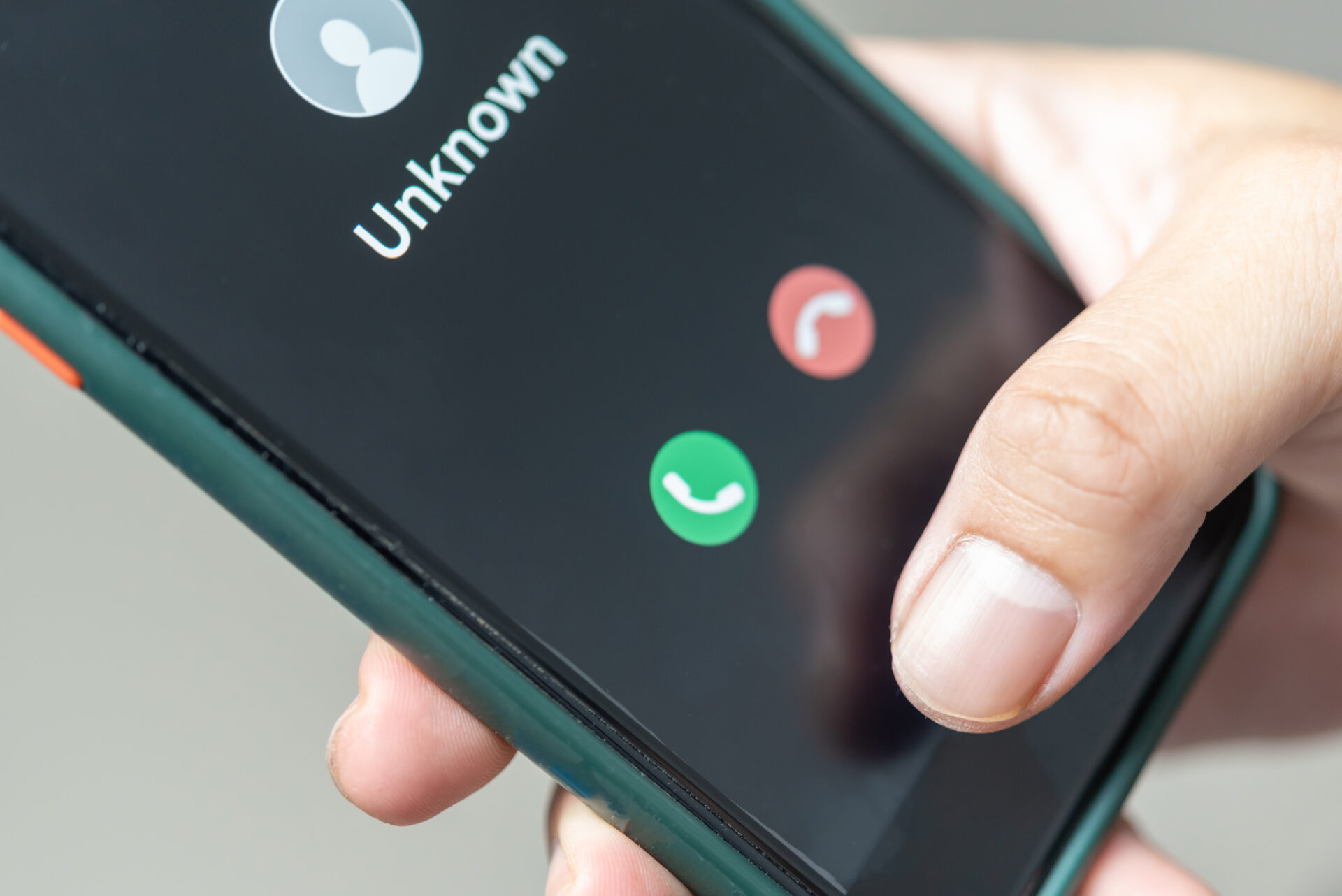 man holding mobile phone call from unkown number