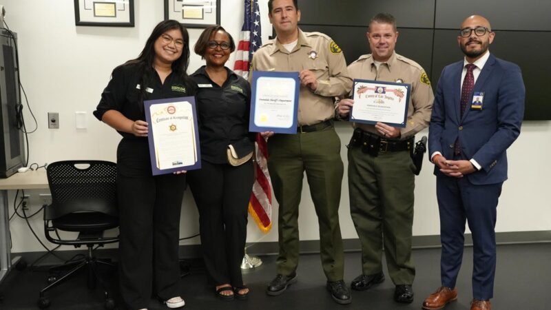 Two Deputies are holding Certificates of Recognition, with Three members of Irwindale City of Commerce.